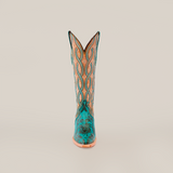 The Premier Turquoise Handtooled Flowers boot, in teal and tan, crafted from premium quality leather with intricate patterns and stitching, stands upright against a plain white background.