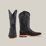 A pair of Exotic Python Matte Black cowboy boots, one facing forward and the other sideways. They feature square toes, wooden soles, and intricate stitching, set against a plain beige background.